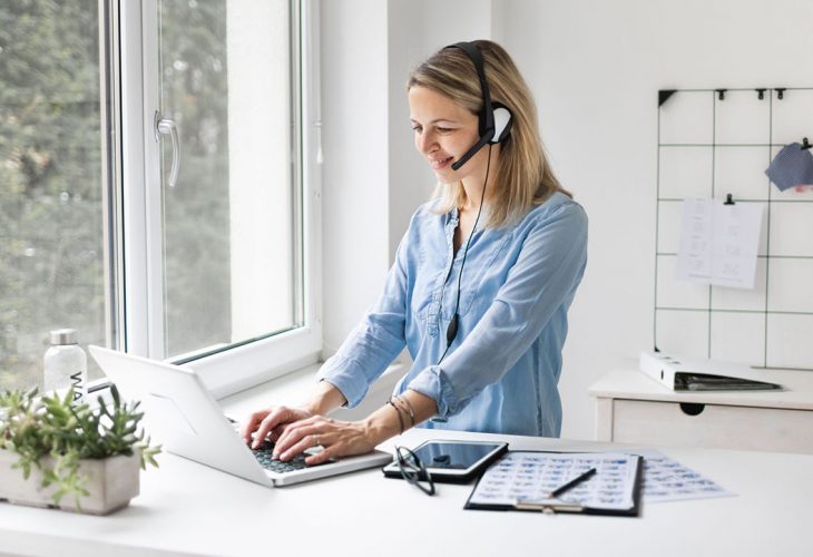 woman working at standing ergo desk