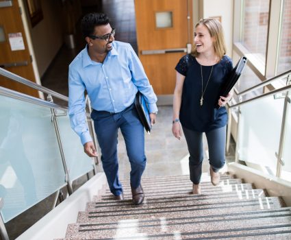 Beacon employees on staircase