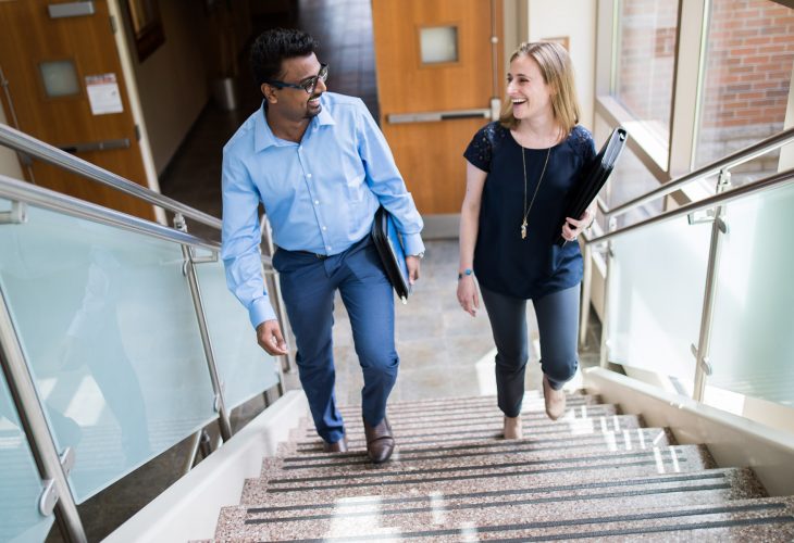 Beacon employees on staircase