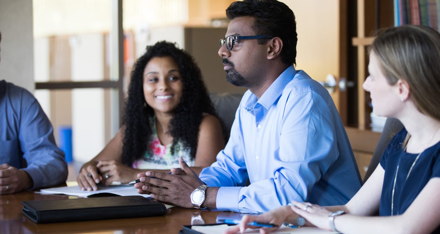 Employees discussing policy