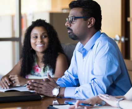 Employees discussing policy