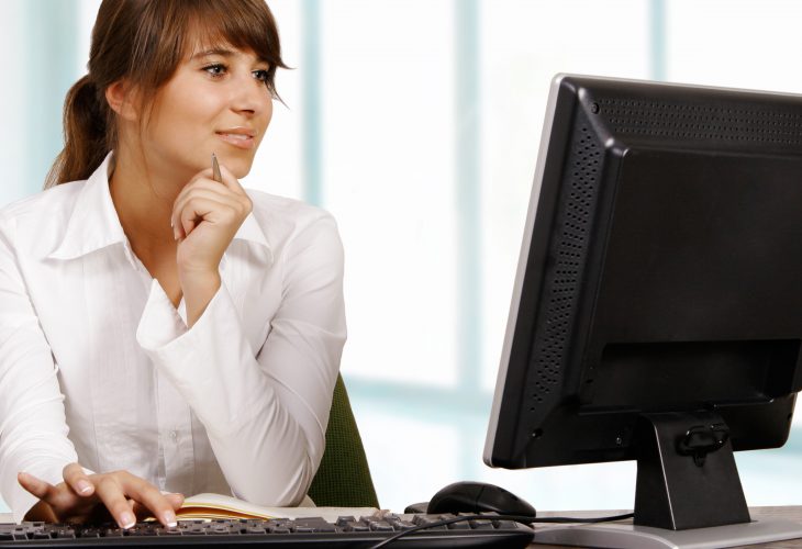 Young woman working with computer