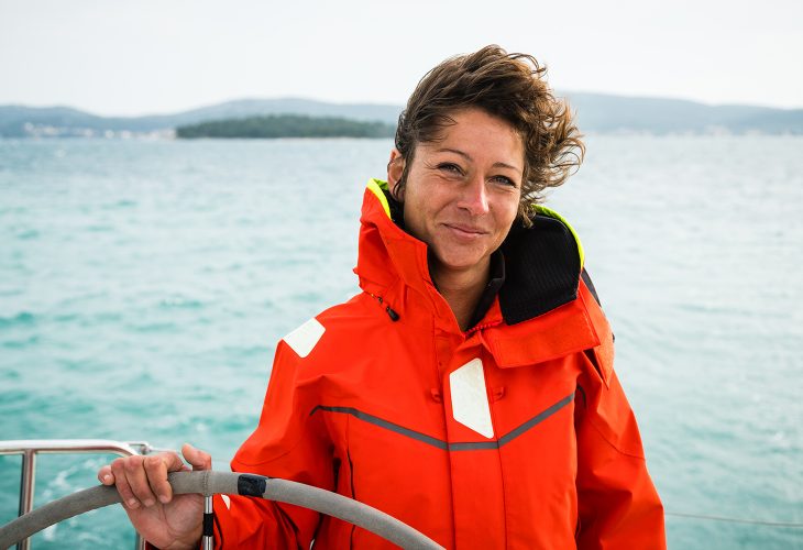 Adult Woman Holding the Rudder on Sailing Boat